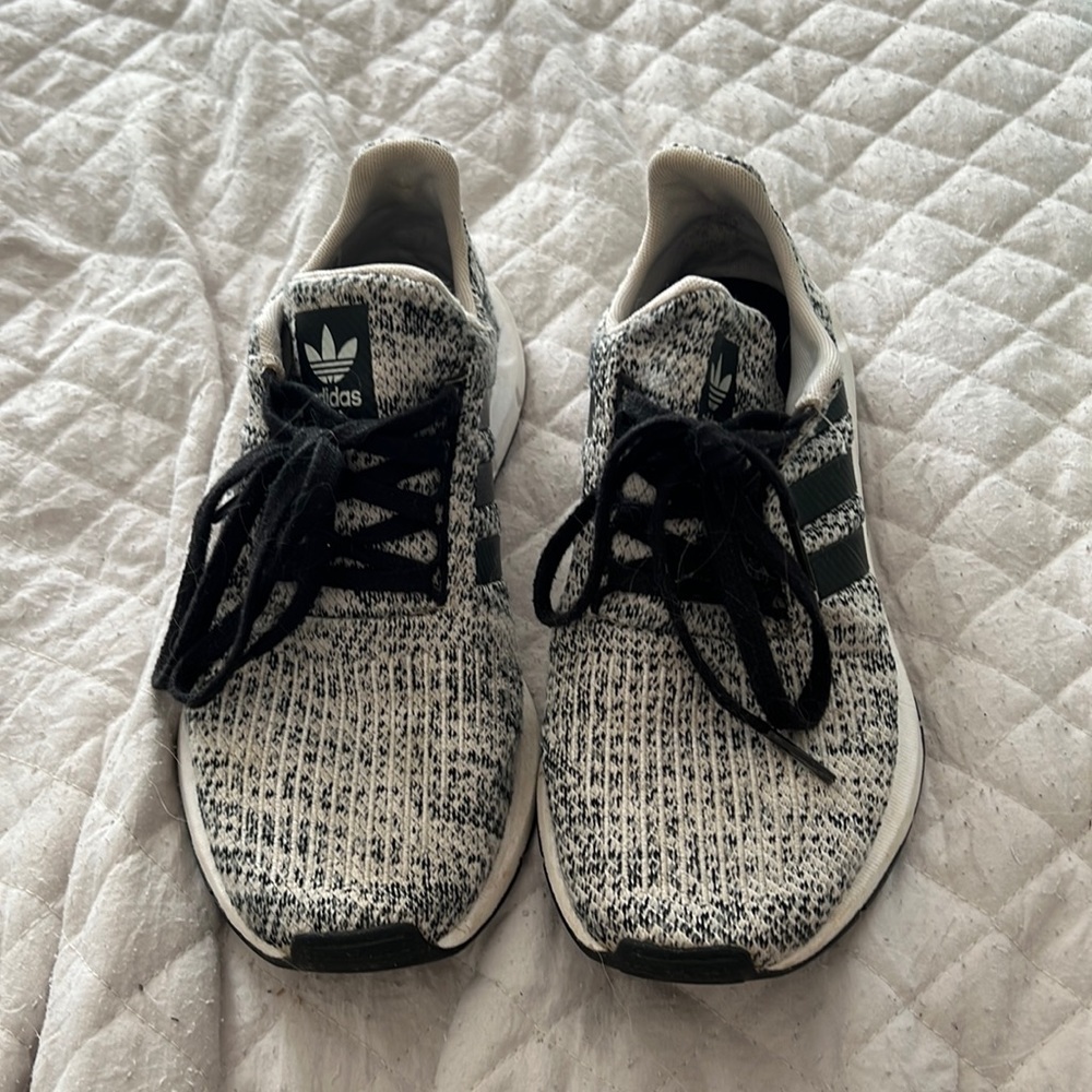 Black and white adidas tennis shoes